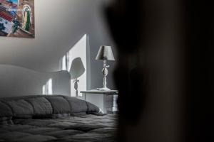 A bed or beds in a room at Ciuri Ciuri B&B