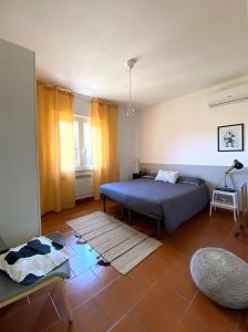 a bedroom with a bed and a table in it at Casa Morlè in Marina di Campo