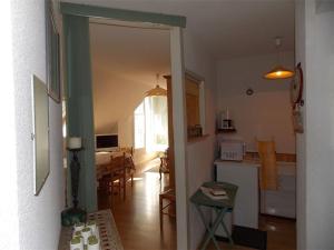 a room with a kitchen and a dining room at Luchon - Duplex 6 pers, Balcon Sud, Parking, Animaux admis - FR-1-313-161 in Luchon +9 photos