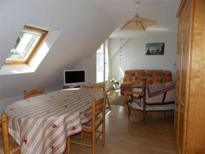 a bedroom with a bed and a living room at Luchon - Duplex 6 pers, Balcon Sud, Parking, Animaux admis - FR-1-313-161 in Luchon