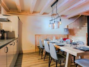 a dining room with a long table and chairs at Chalet Val Thorens, 6 pièces, 11 personnes - FR-1-545-27 in Val Thorens