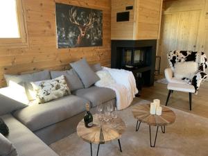 a living room with a couch and a fireplace at Chalet Montgenèvre, 5 pièces, 10 personnes - FR-1-266-179 in Montgenèvre