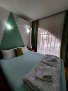 Voodi või voodid majutusasutuse The Bulevard Hotel toas