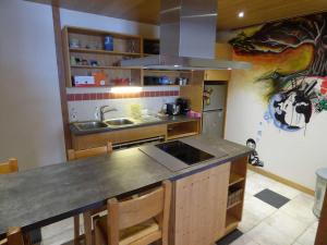 a kitchen with a sink and a counter top at Charmant Studio de 50m² pour 2, pieds des pistes au Chinaillon - FR-1-458-153 in Le Grand-Bornand +11 photos