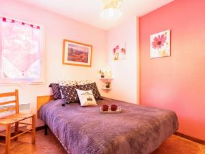 a bedroom with a bed and a chair and a window at Confort et Accès Facile : Proche Télécabine, 2 Chambres - FR-1-296-364 in Saint-Lary-Soulan