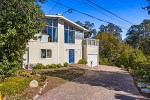 a large white house with a driveway at El Camino De La Luz Adventure in Santa Barbara