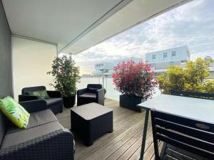a balcony with a table and chairs and plants at Appartement La Baule, 1 pièce, 4 personnes - FR-1-245-162 in La Baule