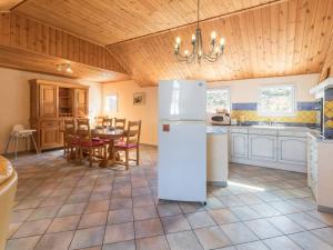 a kitchen with a white refrigerator and a table at Grand T4 à Briançon, 6 pers, proche télécabine, commerces, garage et casier à ski inclus - FR-1-330C-57 in Briançon