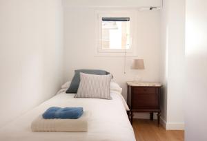 Postel nebo postele na pokoji v ubytování Click&Flat Stylish Torrijos