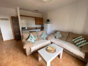 a living room with a couch and a table at Casa LUNA in Frigiliana