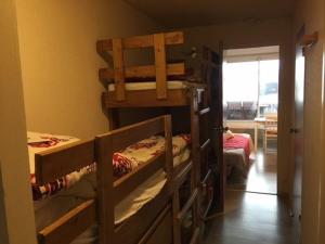 a room with two bunk beds and a hallway at Studio cabine 5 pers, balcon, 80m pistes, animaux ok - FR-1-404-228 in La Mongie