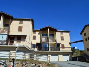 a large building with balconies on the side of it at Appartement T2 lumineux pour 2 pers, Les Angles - FR-1-593-1 in Les Angles +2 photos