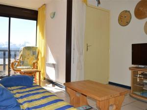a living room with a couch and a table at Appartement T2 lumineux pour 2 pers, Les Angles - FR-1-593-1 in Les Angles