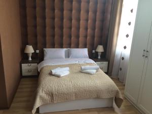 Postel nebo postele na pokoji v ubytování Renaissance Hotel Tbilisi
