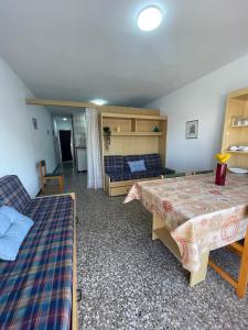 a living room with two beds and a couch at Alpen1 Voramar in Peniscola