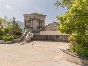 a large building with a staircase in front of it at Appartement Briançon, 1 pièce, 4 personnes - FR-1-330C-116 in Briançon