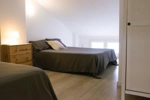 Posteľ alebo postele v izbe v ubytovaní Biznaga House, loft privado e independiente