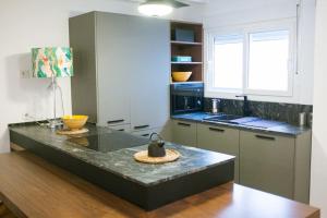 Kuchyňa alebo kuchynka v ubytovaní Biznaga House, loft privado e independiente + 23 fotografií