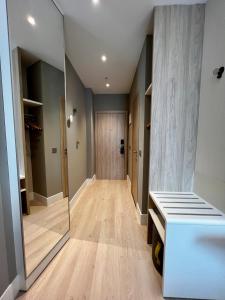a walk in closet with a glass door and a hallway at Holiday Inn Express - Madrid - Airport, an IHG Hotel in Madrid