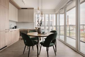 Kuchyňa alebo kuchynka v ubytovaní Glow Apartments, Gdańsk Śląska 12
