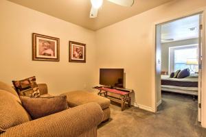 a living room with a couch and a tv and a bed at Waterfront Corpus Christi Townhome with Pool and Dock! in Corpus Christi