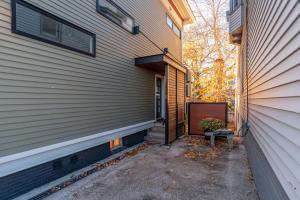 a house with a stairway leading to a door at A Foodies Delight and Cumberland Charm in Portland