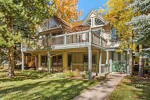 a large house with a wrap around deck at West End Splendor by Snowmass Vacations in Aspen