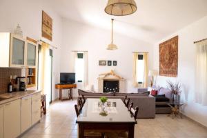 a living room with a couch and a table at Villa Christina Anidri in Ánidhroi