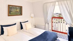 Postel nebo postele na pokoji v ubytování Hotel Kirstine + 37 fotografií