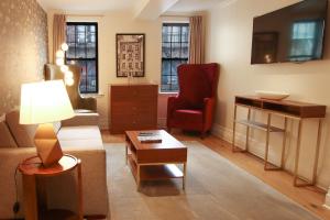 a living room with a couch and a table at Hotel Scherman in New York