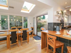 a kitchen and dining room with a table and chairs at Hillsview in Ilfracombe