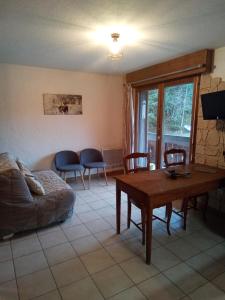 a living room with a couch and a table at cimes d'or in Les Contamines-Montjoie