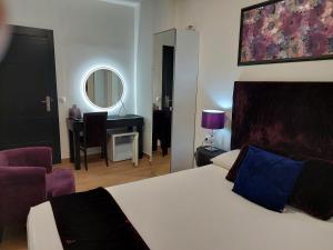 Postel nebo postele na pokoji v ubytování Apartamentos Rous - Solo adultos