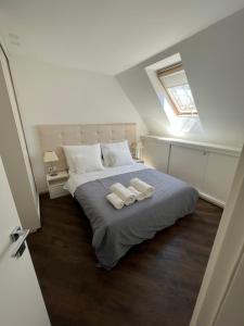 Postel nebo postele na pokoji v ubytování Erkel Rooftop Suites