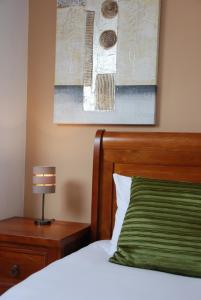 A bed or beds in a room at The Port House 