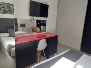 Postel nebo postele na pokoji v ubytování Apartamentos Rous - Solo adultos