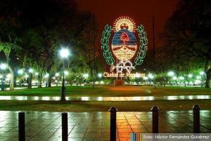 a large lit up sign in a park at night at Oasis 1.6 in Mendoza