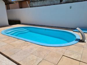 Swimming pool sa o malapit sa Casa na Aruana com piscina e 3/4