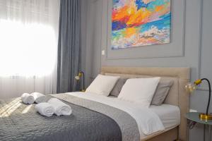Säng eller sängar i ett rum på CityInn Apartment