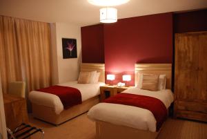 A bed or beds in a room at The Port House 