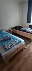 Posteľ alebo postele v izbe v ubytovaní ORSI Eco apartman Kecskemét
