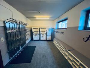 a walk in closet with racks of clothes at Hotel Montana in Telfes im Stubai