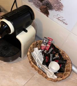 a coffee maker next to a basket of chips at Home sweet home in Chişinău