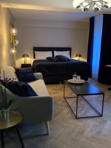 Een bed of bedden in een kamer bij Hotel- en Restaurant Kasteel Elsloo