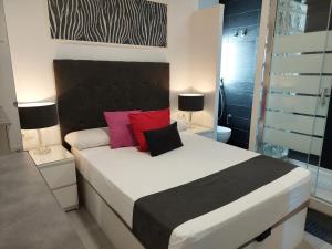 Postel nebo postele na pokoji v ubytování Apartamentos Rous - Solo adultos