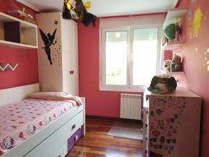 Postel nebo postele na pokoji v ubytování TUS VACACIONES EN SANTANDER + 6 fotografií