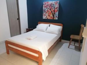 Postel nebo postele na pokoji v ubytování Hotel Casa de las Dos Palmas -Hotel Boutique