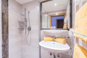 a bathroom with a sink and a shower at Bauernhof Vorderklinglhub in Flachau