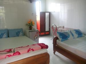 Llit o llits en una habitació de Hai Anh Guesthouse
