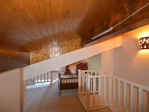 a staircase in a house with a wooden ceiling at Appartement Le Grand-Bornand, 4 pièces, 7 personnes - FR-1-241-218 in Le Grand-Bornand